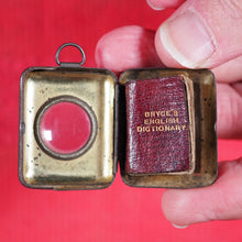 Load image into Gallery viewer, Smallest English Dictionary in the World. >>MINIATURE BRYCE DICTIONARY IN LOCKET<< Publication Date: 1900 CONDITION: GOOD