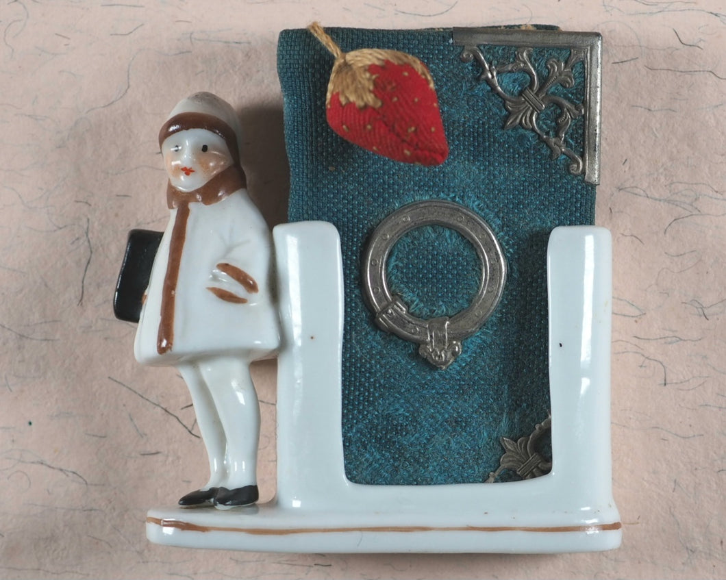 Needlecase 'blook'. Complete with attached bevelled pocket mirror and original 'blook' holder.